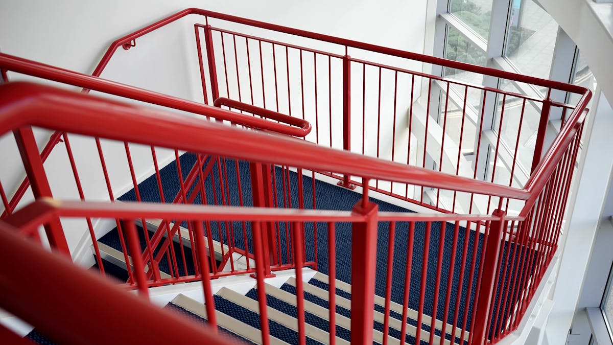 Powder-coated steel stair railing fabrication